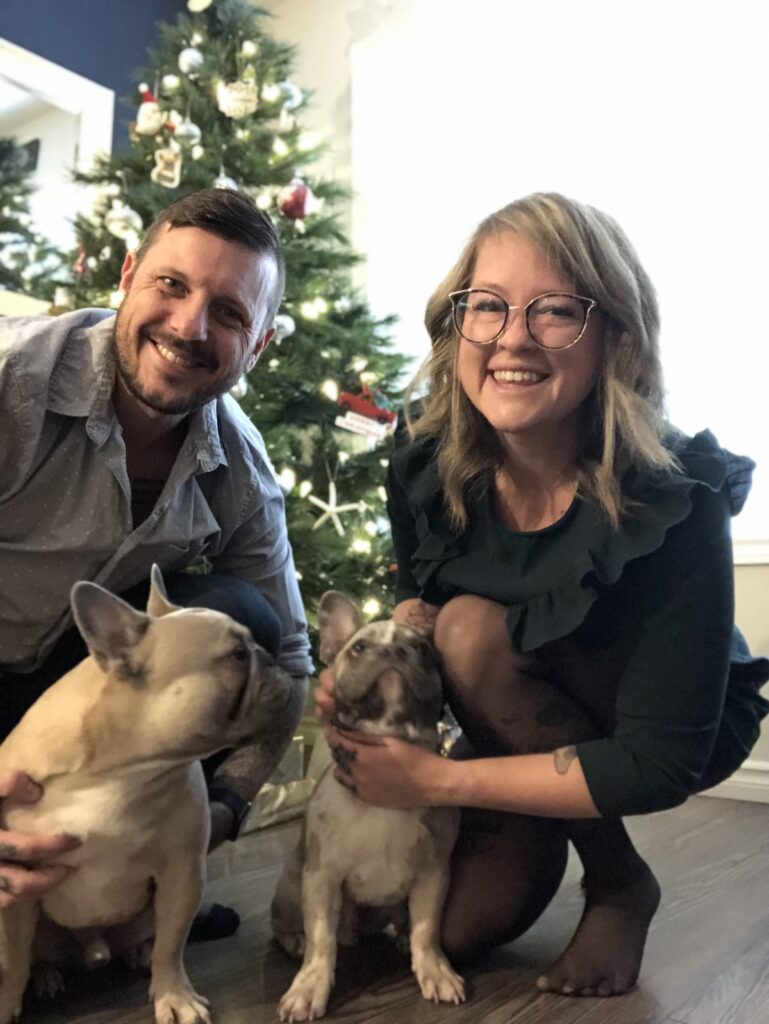 What happened next? Waiting patiently over Christmas 2021 for our response. In front of our Christmas tree with our two dogs. 