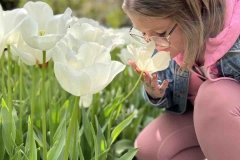 Hayley smelling the Tulips