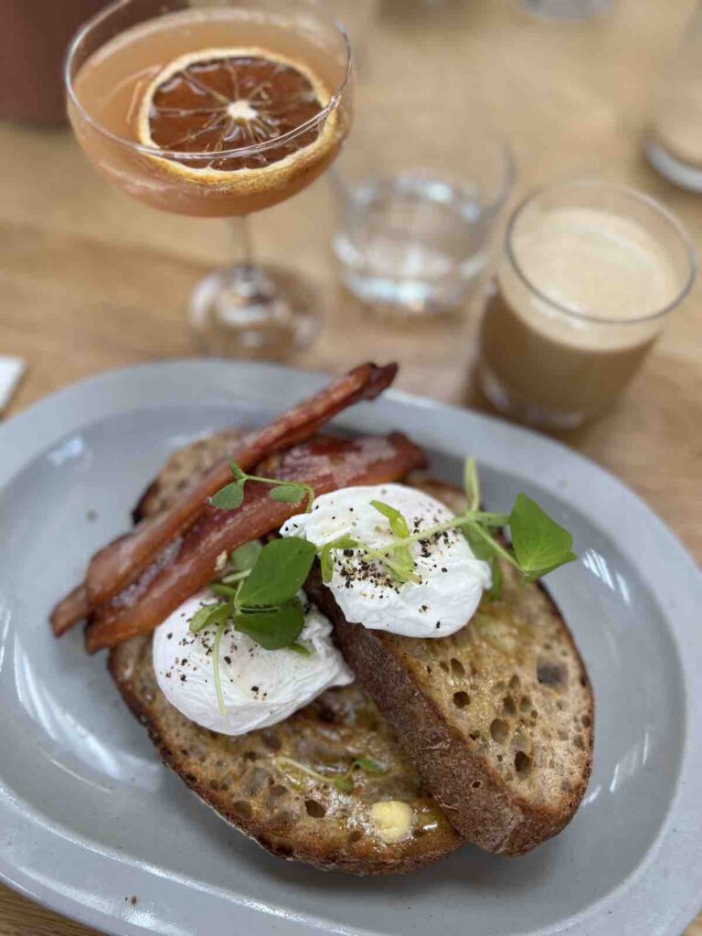 Sourdough Toast, poached eggs and bacon at Marmadukes