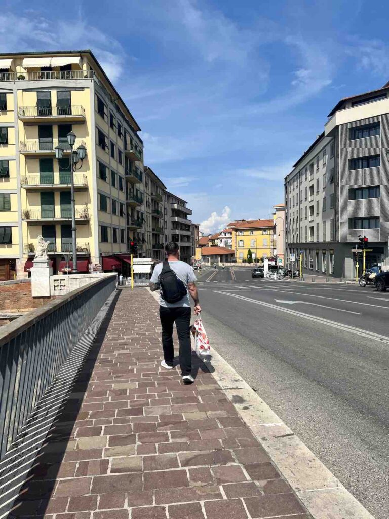 Trevor walking through the streets of Pisa