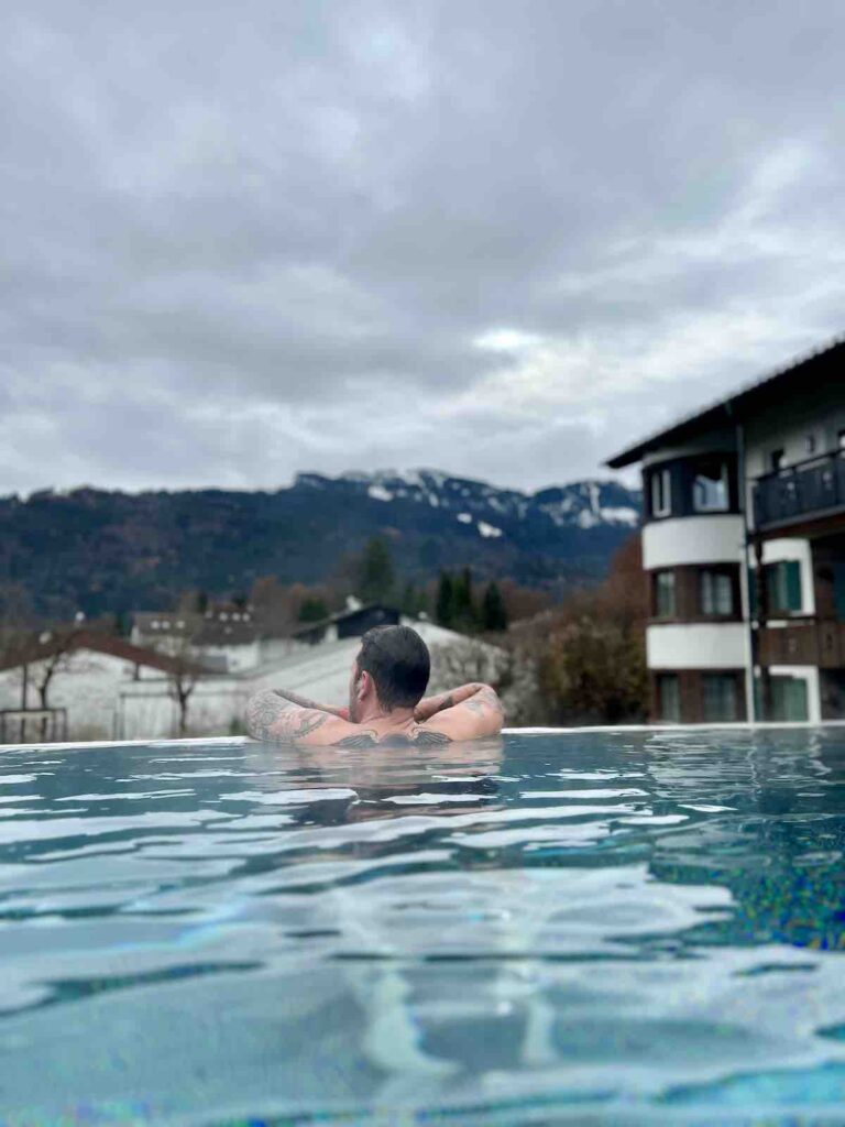 Trevor looking out to the mountains from the infinity outdoor pool