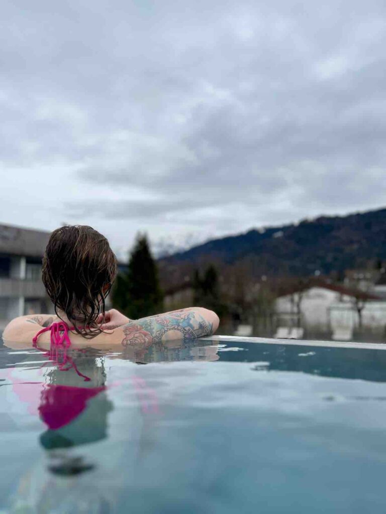 Hayley looking out to the mountains from the infinity outdoor pool
