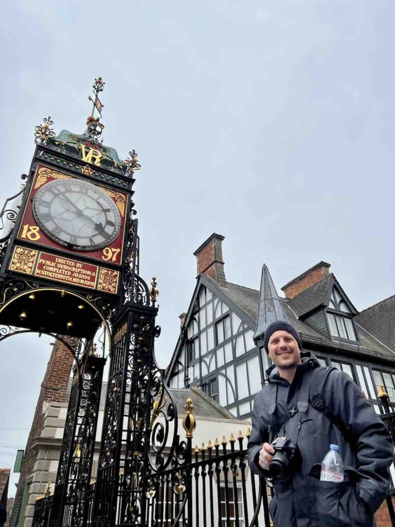 Trevor standing in front of the Eastgate Clock in Chester