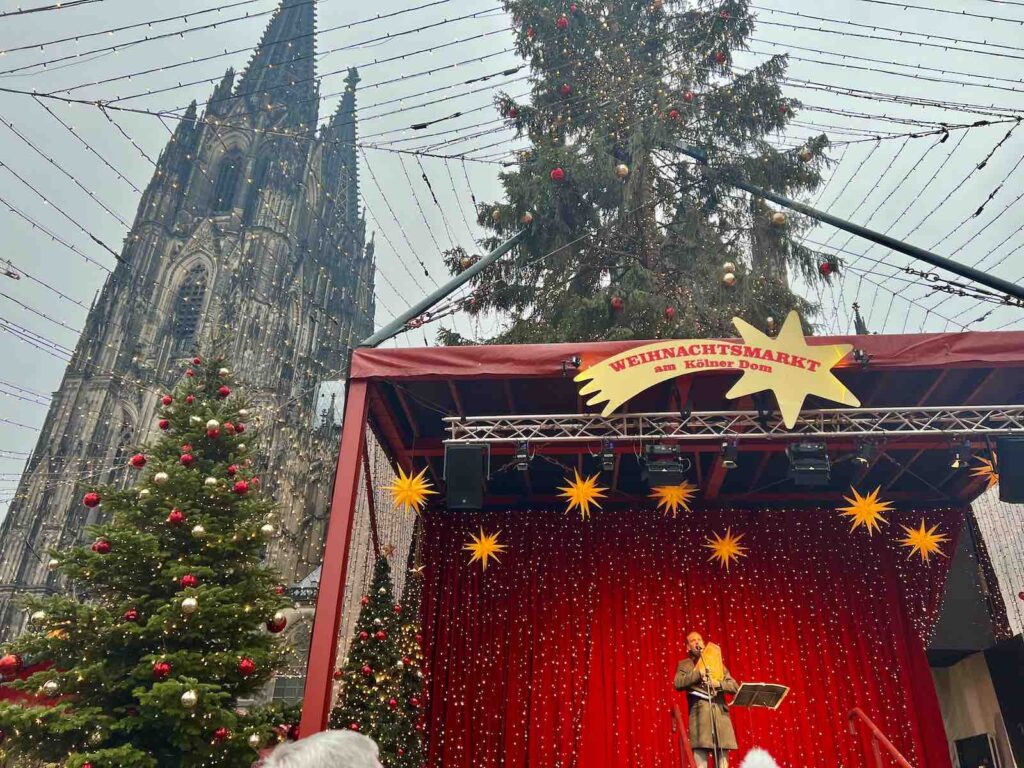 Christmas carols being sung at the Cologne Cathedral Market
